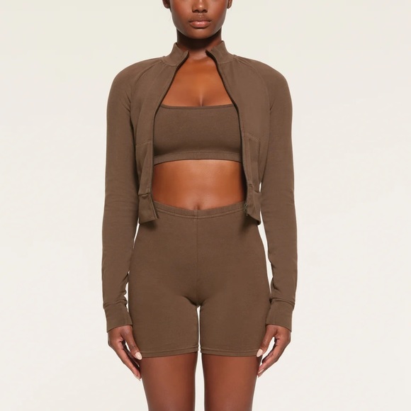 SKIMS Outdoor Mock Neck Cropped Track Jacket in Espresso Faded Brown - Picture 1 of 8